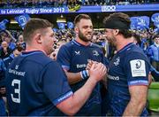 13 April 2024; Leinster players, from left, Tadhg Furlong, Jason Jenkins nd Caelan Doris after their side's victory in the Investec Champions Cup quarter-final match between Leinster and La Rochelle at the Aviva Stadium in Dublin. Photo by Harry Murphy/Sportsfile