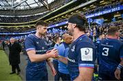 13 April 2024; Ross Byrne and Caelan Doris of Leinster after their side's victory in the Investec Champions Cup quarter-final match between Leinster and La Rochelle at the Aviva Stadium in Dublin. Photo by Harry Murphy/Sportsfile