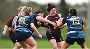 14 April 2024; Emma Cordial of Roscrea is tackled by Rhiannon Hoey, right, and Martina O'Neill of Navan during the Women's Division 5 Cup final match between Navan and Roscrea during the Bank of Ireland Leinster Rugby Women Finals Day at Balbriggan RFC in Dublin. Photo by Ben McShane/Sportsfile