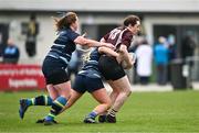 14 April 2024; Eimear Gleeson of Roscrea is tackled by Geraldine Lynch, left, and Lauren Kelly of Navan during the Women's Division 5 Cup final match between Navan and Roscrea during the Bank of Ireland Leinster Rugby Women Finals Day at Balbriggan RFC in Dublin. Photo by Ben McShane/Sportsfile