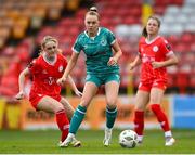 13 April 2024; Joy Ralph of Shamrock Rovers in action against Maggie Pierce, left, and Christie Gray of Shelbourne during the SSE Airtricity Women's Premier Division match between Shelbourne and Shamrock Rovers at Tolka Park in Dublin. Photo by Stephen McCarthy/Sportsfile
