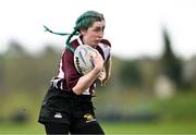 14 April 2024; Rachel Palmer of Roscrea on her way to scoring a try during the Women's Division 5 Cup final match between Navan and Roscrea during the Bank of Ireland Leinster Rugby Women Finals Day at Balbriggan RFC in Dublin. Photo by Ben McShane/Sportsfile