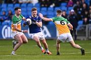 13 April 2024; Mark Timmons of Laois in action against Nathan Poland, left, and Peter Cunningham of Offaly during the Leinster GAA Football Senior Championship quarter-final match between Offaly and Laois at Laois Hire O’Moore Park in Portlaoise, Laois. Photo by Piaras Ó Mídheach/Sportsfile