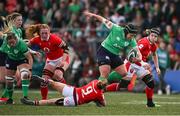 13 April 2024; Christy Haney of Ireland is tackled by Keira Bevan of Wales during the Women's Six Nations Rugby Championship match between Ireland and Wales at Virgin Media Park in Cork.  Photo by Brendan Moran/Sportsfile