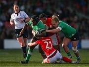 13 April 2024; Linda Djougang of Ireland is tackled by Sian Jones of Wales during the Women's Six Nations Rugby Championship match between Ireland and Wales at Virgin Media Park in Cork.  Photo by Brendan Moran/Sportsfile