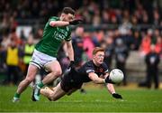 14 April 2024; Ciaran Mackin of Armagh in action against Conor McShea of Fermanagh during the Ulster GAA Football Senior Championship quarter-final match between Fermanagh and Armagh at Brewster Park in Enniskillen, Fermanagh. Photo by Ramsey Cardy/Sportsfile