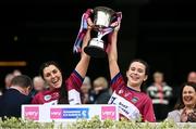 14 April 2024; Westmeath joint captains Julie McLoughlin, left, and Aoife O'Malley lift the trophy after the Very Camogie All-Ireland League Division 2A Final between Derry and Westmeath at Croke Park in Dublin. Photo by David Fitzgerald/Sportsfile