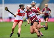 14 April 2024; Megan Dowdall of Westmeath in action against Megan Kerr of Derry during the Very Camogie All-Ireland League Division 2A Final between Derry and Westmeath at Croke Park in Dublin. Photo by David Fitzgerald/Sportsfile