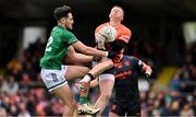 14 April 2024; Armagh goalkeeper Blaine Hughes in action against Fionan O'Brien of Fermanagh during the Ulster GAA Football Senior Championship quarter-final match between Fermanagh and Armagh at Brewster Park in Enniskillen, Fermanagh. Photo by Ramsey Cardy/Sportsfile