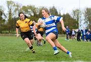 14 April 2024; Clara Sexton of Athy makes a break on her way to scoring a try during the Cusack Plate final match between Athy and Ashbourne during the Bank of Ireland Leinster Rugby Women Finals Day at Balbriggan RFC in Dublin. Photo by Ben McShane/Sportsfile