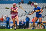 14 April 2024; Orlaith McGrath of Galway is hooked by Mairead Eviston of Tipperary during the Very Camogie League Division 1A Final between Tipperary and Galway at Croke Park in Dublin. Photo by Brendan Moran/Sportsfile