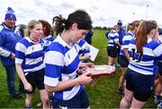 14 April 2024; Athy captain Liz Brophy looks at the shield after her side's victory in the Cusack Plate final match between Athy and Ashbourne during the Bank of Ireland Leinster Rugby Women Finals Day at Balbriggan RFC in Dublin. Photo by Ben McShane/Sportsfile