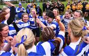 14 April 2024; Athy captain Liz Brophy celebrates with her teammates and the Cusack Plate after their side's victory in the Cusack Plate final match between Athy and Ashbourne during the Bank of Ireland Leinster Rugby Women Finals Day at Balbriggan RFC in Dublin. Photo by Ben McShane/Sportsfile