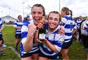 14 April 2024; Meabh Collins, left, and Lily Cunningham of Athy celebrate with a bottle of champagne after their side's victory in the Cusack Plate final match between Athy and Ashbourne during the Bank of Ireland Leinster Rugby Women Finals Day at Balbriggan RFC in Dublin. Photo by Ben McShane/Sportsfile
