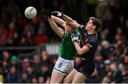 14 April 2024; Jarly Óg Burns of Armagh in action against Ronan McCaffrey of Fermanagh during the Ulster GAA Football Senior Championship quarter-final match between Fermanagh and Armagh at Brewster Park in Enniskillen, Fermanagh. Photo by Ramsey Cardy/Sportsfile