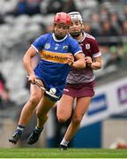 14 April 2024; Karen Kennedy of Tipperary in action against Ally Hesnan of Galway during the Very Camogie League Division 1A Final between Tipperary and Galway at Croke Park in Dublin. Photo by Brendan Moran/Sportsfile