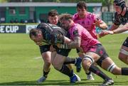 14 April 2024; Peter Dooley of Connacht is tackled by Lorenzo Cannone of Benetton during the EPCR Challenge Cup quarter-final match between Benetton and Connacht at Stadio Monigo in Treviso, Italy. Photo by Roberto Bregani/Sportsfile