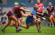 14 April 2024; Roisin Howard of Tipperary in action against Niamh Hanniffy of Galway and Niamh McPeake of Galway during the Very Camogie League Division 1A Final between Tipperary and Galway at Croke Park in Dublin. Photo by Brendan Moran/Sportsfile