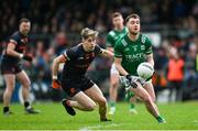 14 April 2024; Conor McShea of Fermanagh in action against Andrew Murnin of Armagh during the Ulster GAA Football Senior Championship quarter-final match between Fermanagh and Armagh at Brewster Park in Enniskillen, Fermanagh. Photo by Ramsey Cardy/Sportsfile