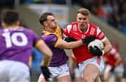 14 April 2024; Conor Grimes of Louth in action against Dylan Furlong of Wexford during the Leinster GAA Football Senior Championship quarter-final match between Louth and Wexford at Laois Hire O’Moore Park in Portlaoise, Laois. Photo by Sam Barnes/Sportsfile
