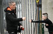14 April 2024; Armagh manager Kieran McGeeney and Armagh supporter Charlie Kearney, age 11, from Blackwatertown, before the Ulster GAA Football Senior Championship quarter-final match between Fermanagh and Armagh at Brewster Park in Enniskillen, Fermanagh. Photo by Ramsey Cardy/Sportsfile