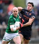 14 April 2024; Lee Cullen of Fermanagh in action against Stefan Campbell of Armagh during the Ulster GAA Football Senior Championship quarter-final match between Fermanagh and Armagh at Brewster Park in Enniskillen, Fermanagh. Photo by Ramsey Cardy/Sportsfile