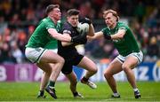 14 April 2024; Joe McElroy of Armagh in action against Oisin Smyth, left, and Ultán Kelm of Fermanagh during the Ulster GAA Football Senior Championship quarter-final match between Fermanagh and Armagh at Brewster Park in Enniskillen, Fermanagh. Photo by Ramsey Cardy/Sportsfile