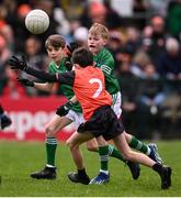 14 April 2024; Fionn Brewster, representing Fermanagh Cumann na mBunscol, grandson of Michael Brewster, who Brewster Park is named after, and son of former Fermanagh player Tom Brewster, in action against Jake Lennon, representing Armagh Cumann na mBunscol during the Ulster GAA Football Senior Championship quarter-final match between Fermanagh and Armagh at Brewster Park in Enniskillen, Fermanagh. Photo by Ramsey Cardy/Sportsfile