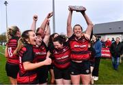 14 April 2024; Tullamore captain Shannon Tuohey celebrates with the Flood Plate and her teammates after winning the Flood Plate final match between Mullingar and Tullamore during the Bank of Ireland Leinster Rugby Women Finals Day at Balbriggan RFC in Dublin. Photo by Ben McShane/Sportsfile