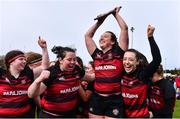 14 April 2024; Tullamore captain Shannon Tuohey celebrates with the Flood Plate and her teammates after winning the Flood Plate final match between Mullingar and Tullamore during the Bank of Ireland Leinster Rugby Women Finals Day at Balbriggan RFC in Dublin. Photo by Ben McShane/Sportsfile