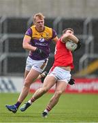 14 April 2024; Sam Mulroy of Louth in action against Darragh Lyons of Wexford during the Leinster GAA Football Senior Championship quarter-final match between Louth and Wexford at Laois Hire O’Moore Park in Portlaoise, Laois. Photo by Sam Barnes/Sportsfile