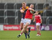 14 April 2024; Sam Mulroy of Louth in action against Darragh Lyons of Wexford during the Leinster GAA Football Senior Championship quarter-final match between Louth and Wexford at Laois Hire O’Moore Park in Portlaoise, Laois. Photo by Sam Barnes/Sportsfile