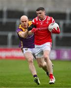 14 April 2024; Conall McKeever of Louth in action against Kevin O'Grady of Wexford during the Leinster GAA Football Senior Championship quarter-final match between Louth and Wexford at Laois Hire O’Moore Park in Portlaoise, Laois. Photo by Sam Barnes/Sportsfile