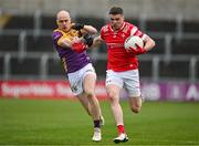14 April 2024; Conall McKeever of Louth in action against Kevin O'Grady of Wexford during the Leinster GAA Football Senior Championship quarter-final match between Louth and Wexford at Laois Hire O’Moore Park in Portlaoise, Laois. Photo by Sam Barnes/Sportsfile
