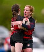 14 April 2024; Leah McInearney of Tullamore celebrates  with teammate Sinead Rigney, right, after scoring a try during the Flood Plate final match between Mullingar and Tullamore during the Bank of Ireland Leinster Rugby Women Finals Day at Balbriggan RFC in Dublin. Photo by Ben McShane/Sportsfile