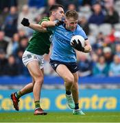 14 April 2024; Seán Bugler of Dublin is tackled by Ciarán Caulfield of Meath during the Leinster GAA Football Senior Championship quarter-final match between Dublin and Meath at Croke Park in Dublin. Photo by Brendan Moran/Sportsfile