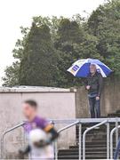 14 April 2024; A spectator in the rain during the Leinster GAA Football Senior Championship quarter-final match between Louth and Wexford at Laois Hire O’Moore Park in Portlaoise, Laois. Photo by Piaras Ó Mídheach/Sportsfile