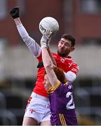 14 April 2024; Ciarán Downey of Louth in action against Shane Pettit of Wexford during the Leinster GAA Football Senior Championship quarter-final match between Louth and Wexford at Laois Hire O’Moore Park in Portlaoise, Laois. Photo by Piaras Ó Mídheach/Sportsfile