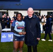 14 April 2024; Prudence Isaac of MU Barnhall is presented with her Player of the Match award by Leinster Rugby president Billy Murphy after the Flood Cup final match between Tullow and MU Barnhall during the Bank of Ireland Leinster Rugby Women Finals Day at Balbriggan RFC in Dublin. Photo by Ben McShane/Sportsfile