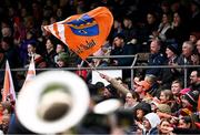 14 April 2024; An Armagh supporter waves a flag before the Ulster GAA Football Senior Championship quarter-final match between Fermanagh and Armagh at Brewster Park in Enniskillen, Fermanagh. Photo by Ramsey Cardy/Sportsfile