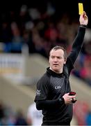 14 April 2024; Referee Sean Lonergan brandishes a yellow card during the Leinster GAA Football Senior Championship quarter-final match between Kildare and Wicklow at Laois Hire O’Moore Park in Portlaoise, Laois. Photo by Sam Barnes/Sportsfile