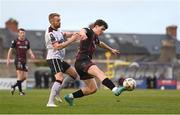 15 April 2024; James Clarke of Bohemians in action against Paul Doyle of Dundalk during the SSE Airtricity Men's Premier Division match between Bohemians and Dundalk at Dalymount Park in Dublin. Photo by Stephen McCarthy/Sportsfile