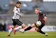 15 April 2024; Archie Davies of Dundalk in action against Martin Miller of Bohemians during the SSE Airtricity Men's Premier Division match between Bohemians and Dundalk at Dalymount Park in Dublin. Photo by Stephen McCarthy/Sportsfile