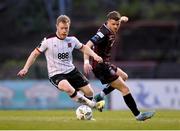 15 April 2024; Daryl Horgan of Dundalk in action against Adam McDonnell of Bohemians during the SSE Airtricity Men's Premier Division match between Bohemians and Dundalk at Dalymount Park in Dublin. Photo by Stephen McCarthy/Sportsfile