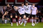 15 April 2024; Zak Bradshaw of Dundalk in action against Filip Piszczek of Bohemians during the SSE Airtricity Men's Premier Division match between Bohemians and Dundalk at Dalymount Park in Dublin. Photo by Stephen McCarthy/Sportsfile