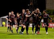 15 April 2024; James Akintunde, third from right, and Bohemians team-mates celebrates after he scored his side's first goal during the SSE Airtricity Men's Premier Division match between Bohemians and Dundalk at Dalymount Park in Dublin. Photo by Stephen McCarthy/Sportsfile