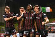 15 April 2024; James Akintunde of Bohemians, second from right, celebrates after scoring his side's first goal with team-mates, from left, Cian Byrne, Adam McDonnell and Dayle Rooney during the SSE Airtricity Men's Premier Division match between Bohemians and Dundalk at Dalymount Park in Dublin. Photo by Stephen McCarthy/Sportsfile
