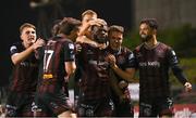 15 April 2024; James Akintunde, centre, and Bohemians team-mates celebrates after he scored his side's first goal during the SSE Airtricity Men's Premier Division match between Bohemians and Dundalk at Dalymount Park in Dublin. Photo by Stephen McCarthy/Sportsfile