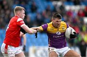 14 April 2024; Glen Malone of Wexford in action against Peter Lynch of Louth during the Leinster GAA Football Senior Championship quarter-final match between Louth and Wexford at Laois Hire O’Moore Park in Portlaoise, Laois. Photo by Sam Barnes/Sportsfile