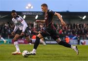 15 April 2024; Filip Piszczek of Bohemians in action against Mayowa Animasahun of Dundalk during the SSE Airtricity Men's Premier Division match between Bohemians and Dundalk at Dalymount Park in Dublin. Photo by Stephen McCarthy/Sportsfile
